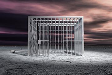 A cubic shaped metal unlocked jail cell