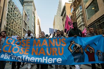 Hundreds of protesters march through George Street