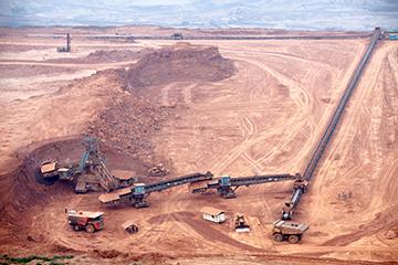 Part of a pit with big mining truck workin