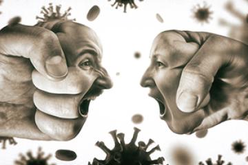 Two fists with mans and womans face are collide