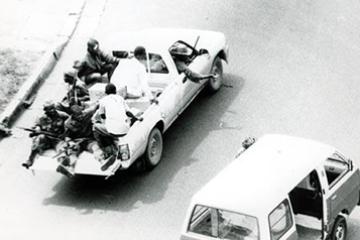 Soldiers drive past the American Embassy